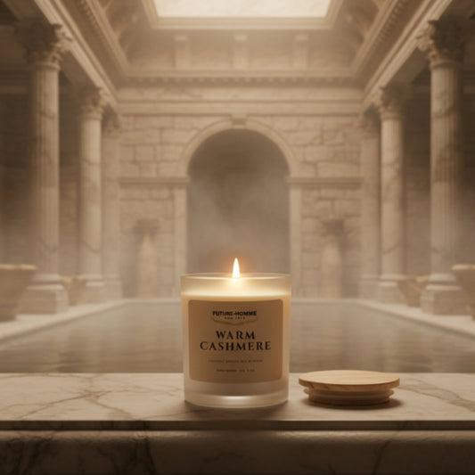 Candle labeled 'Warm Cashmere' in a classical architectural setting
