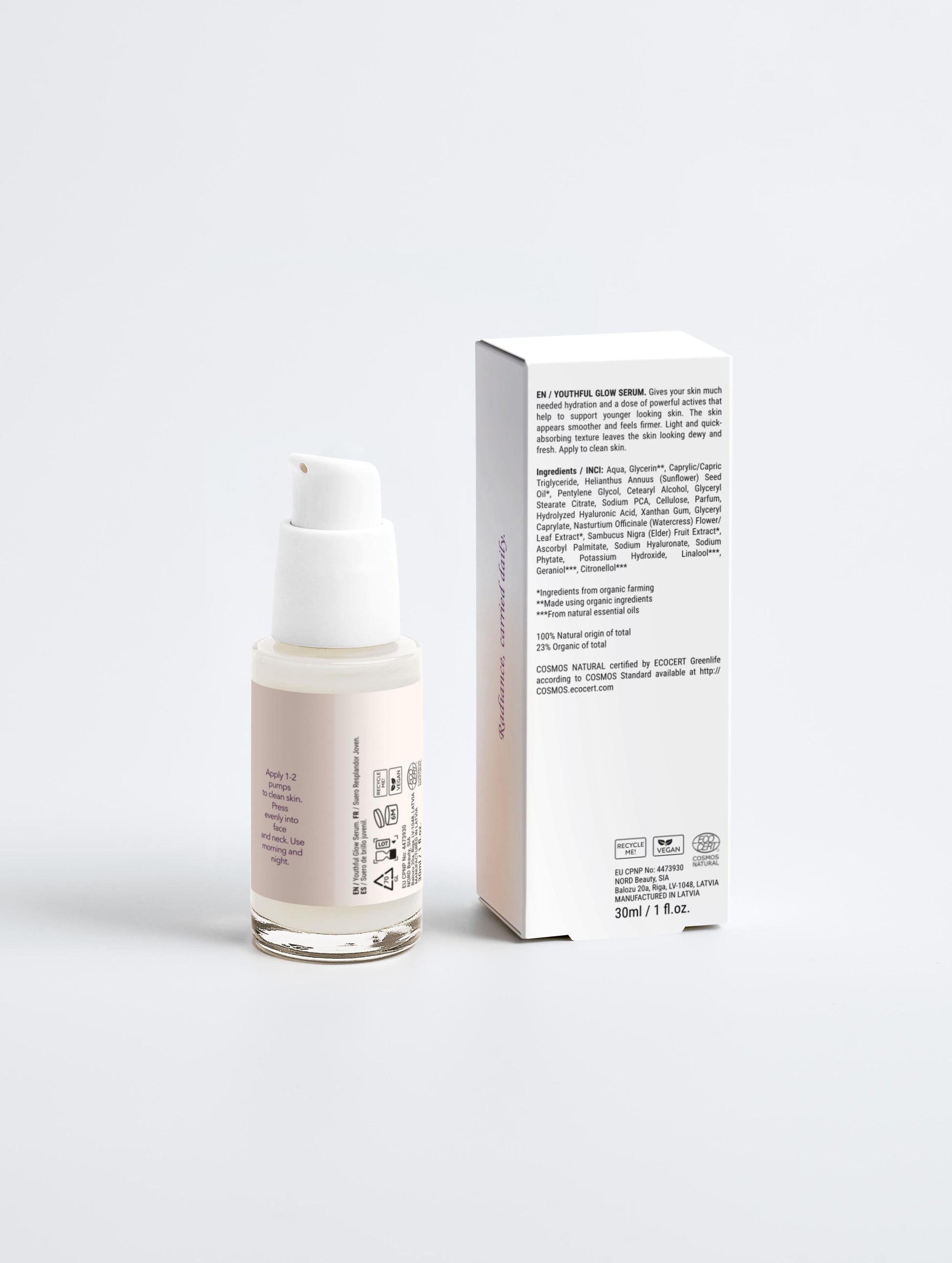 Skincare serum bottle with packaging on a light gray background