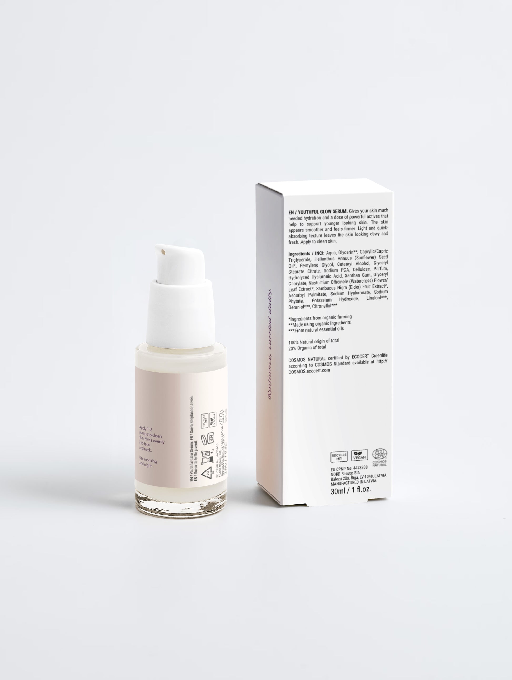 Skincare serum bottle with packaging on a light gray background