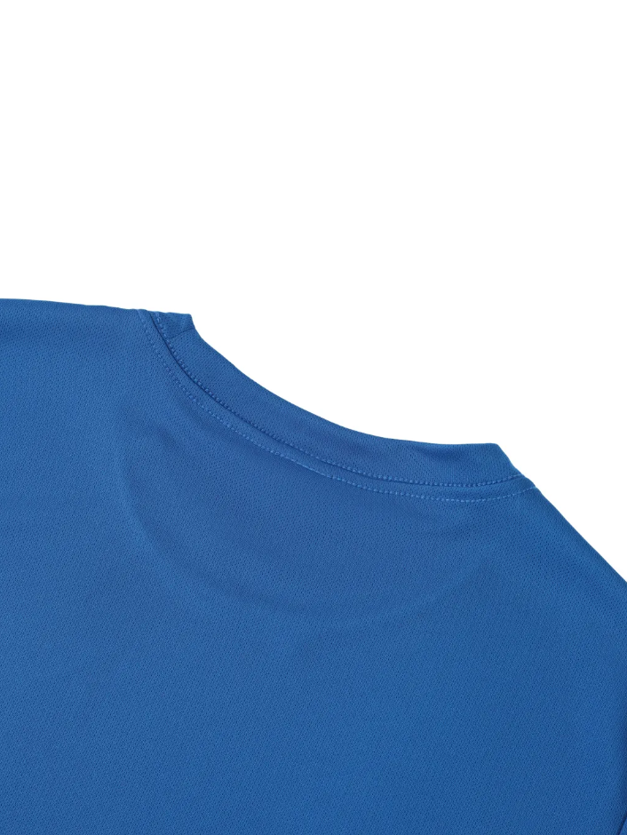 Close-up of a navy blue garment with white stitching on a white background