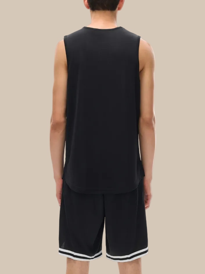 Person wearing a black sleeveless shirt and shorts set on a white background