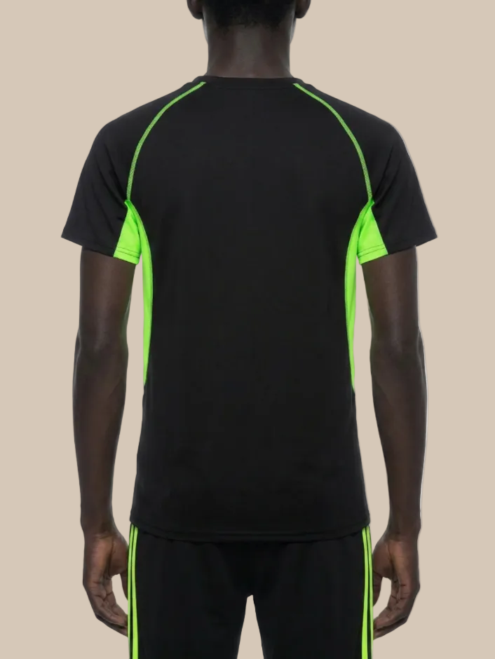 Backside of a man wearing a contrast panel training t-shirt in black and neon green on a beige background. 
