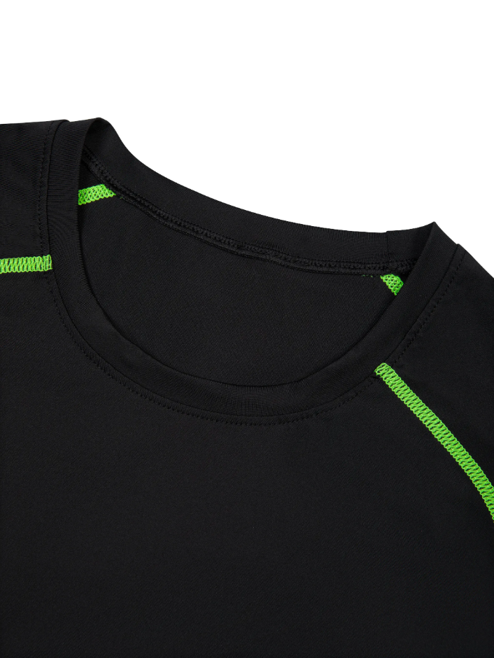 Up close image of the neck line of the training t-shirt in black with green accents on a white background. 