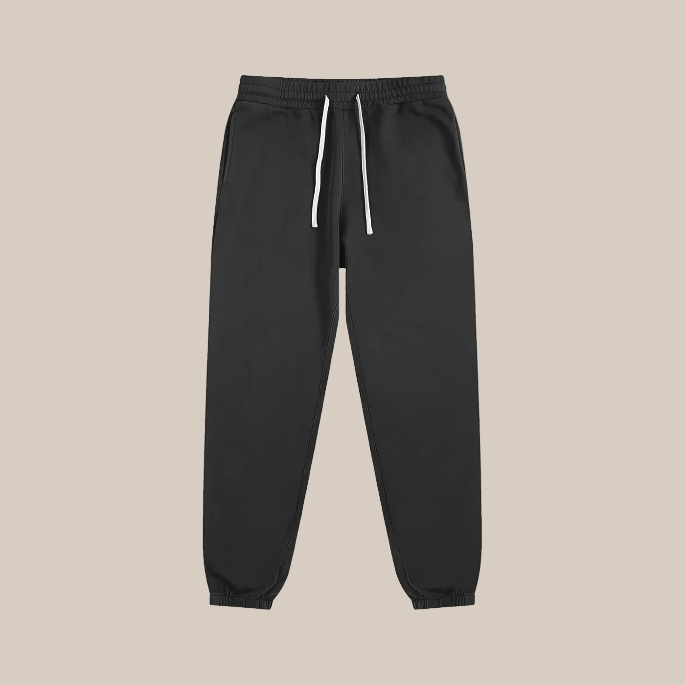 Black sweatpants with a white drawstring on a white background