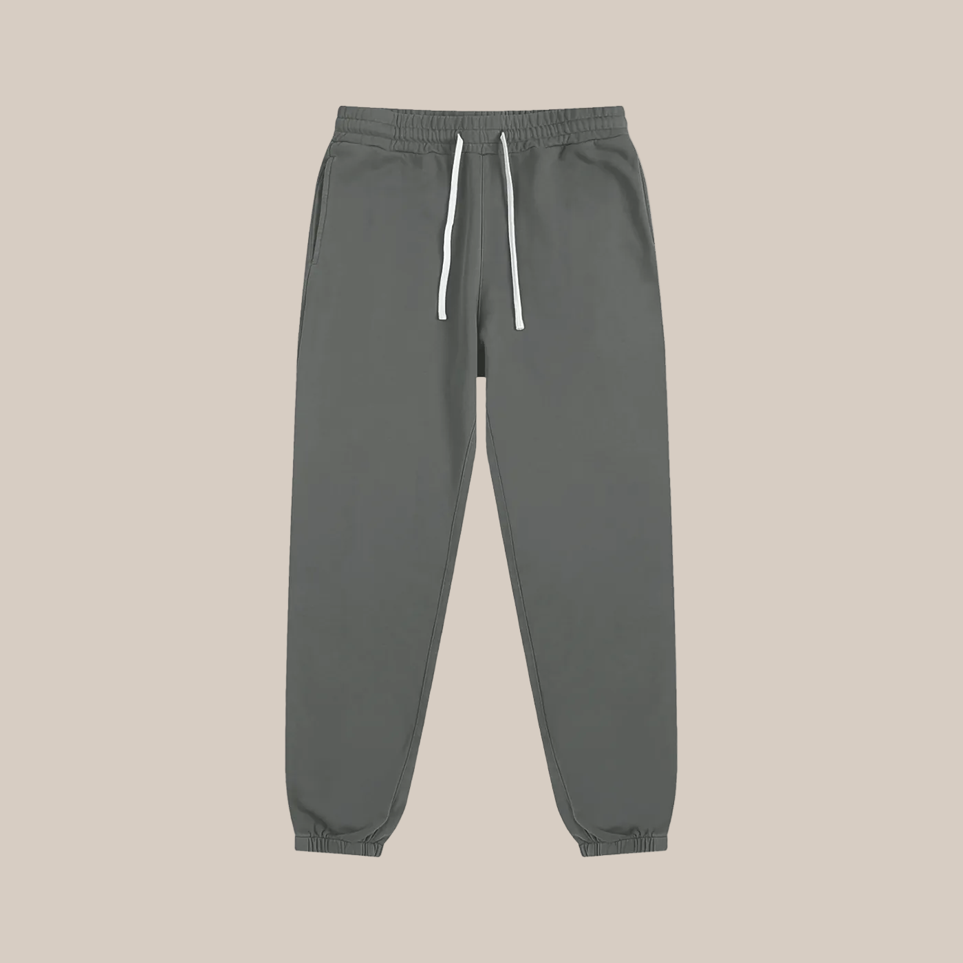 Gray sweatpants with a drawstring on a beige background