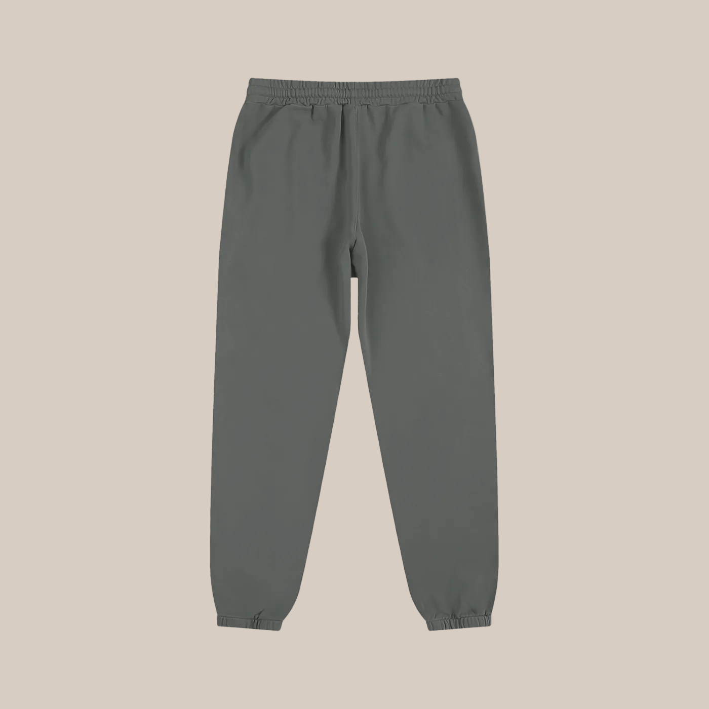 Gray sweatpants on a beige background