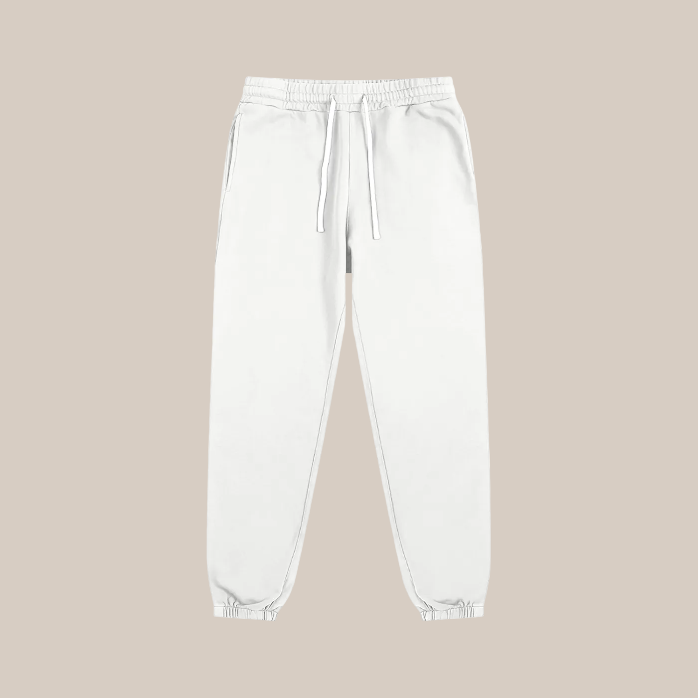 White sweatpants on a beige background