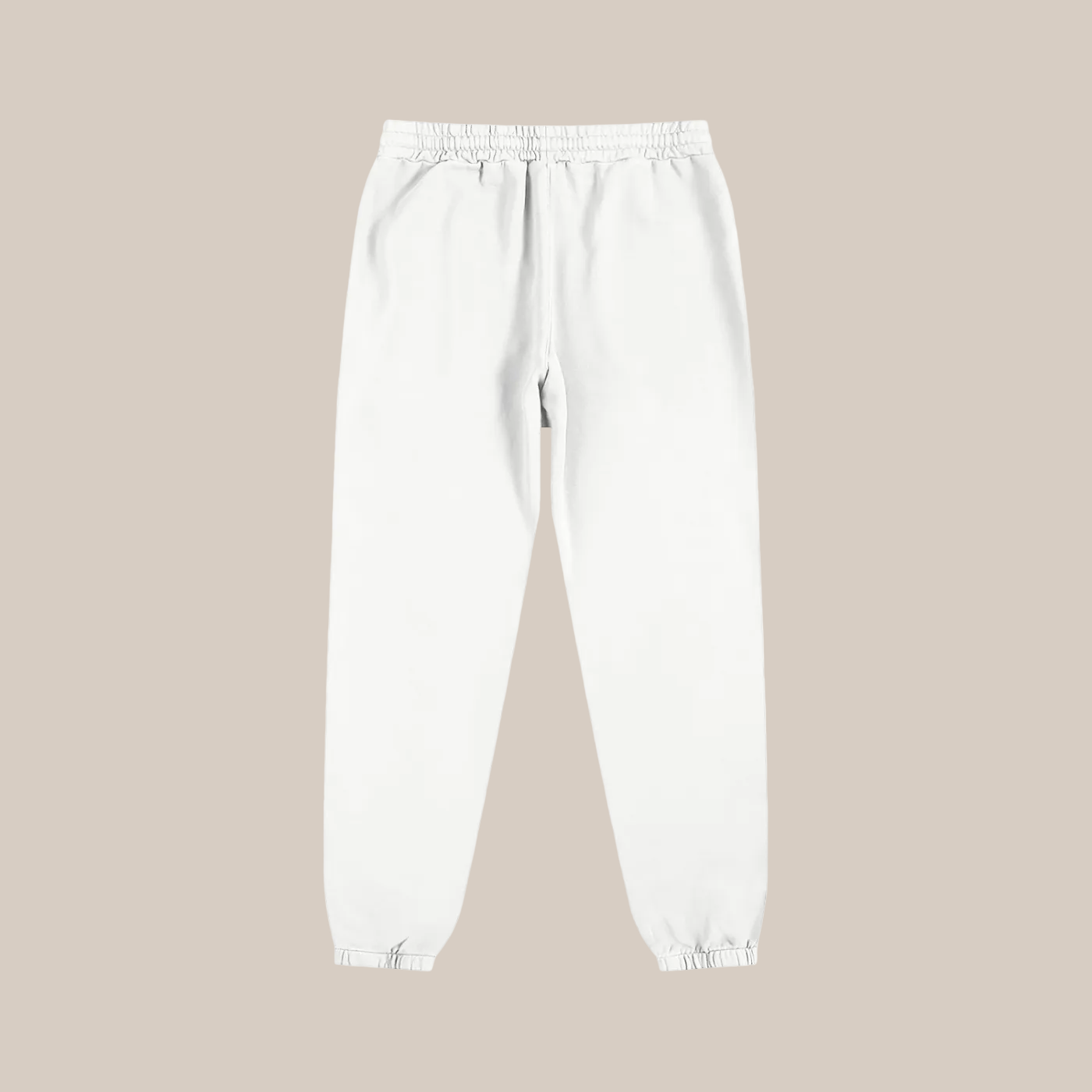 White sweatpants on a beige background
