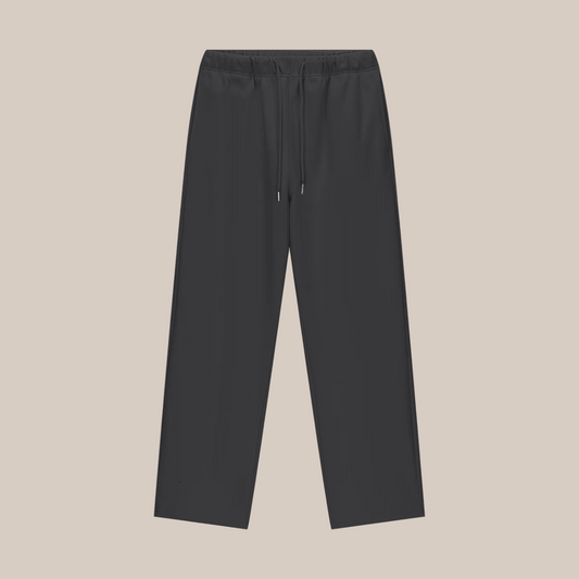 Black pants on a beige background