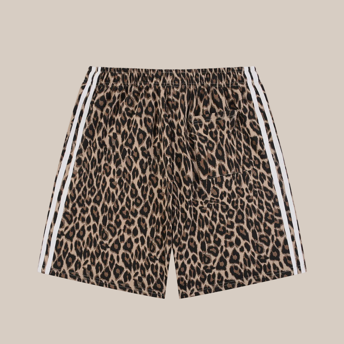 Leopard print shorts with white stripes on a beige background