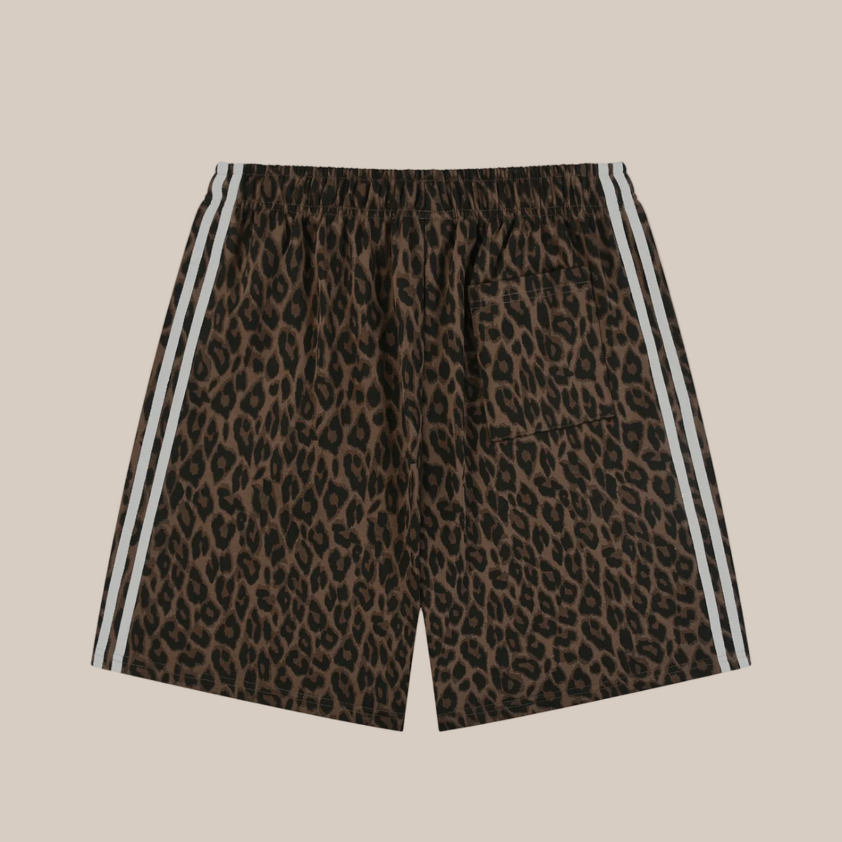Leopard print shorts with white stripes on a beige background