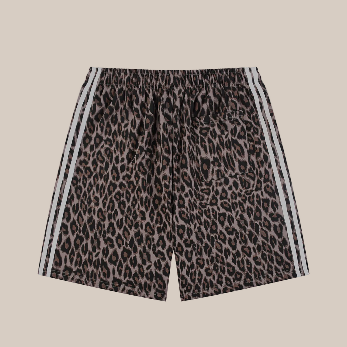 Leopard print shorts with white stripes on a beige background