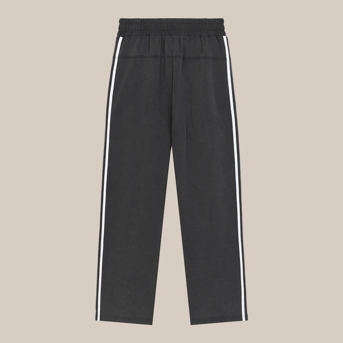 Black pants with white stripes on a beige background