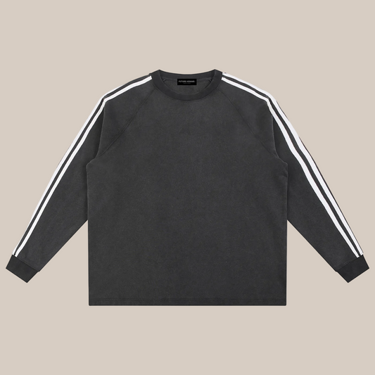 Dark gray long-sleeve shirt with white stripes on sleeves on a beige background