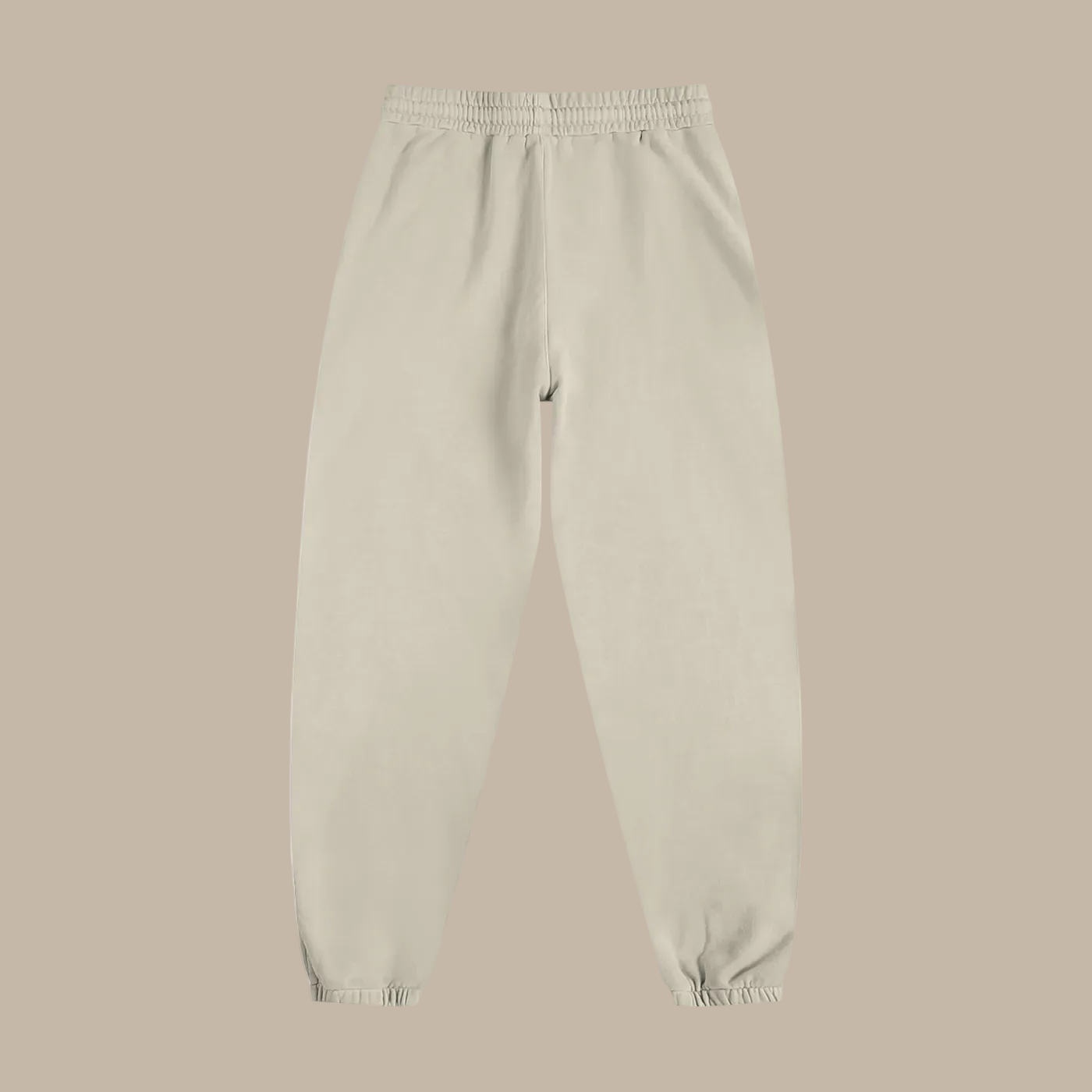 Beige sweatpants on a beige background