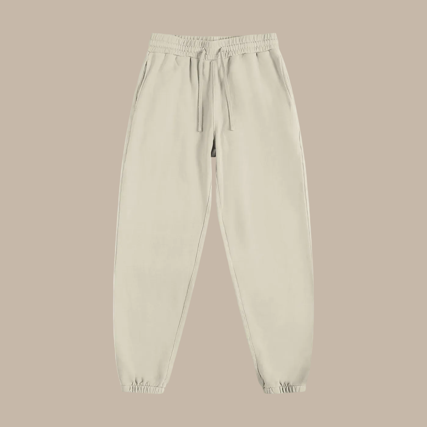 Beige sweatpants on a beige  background