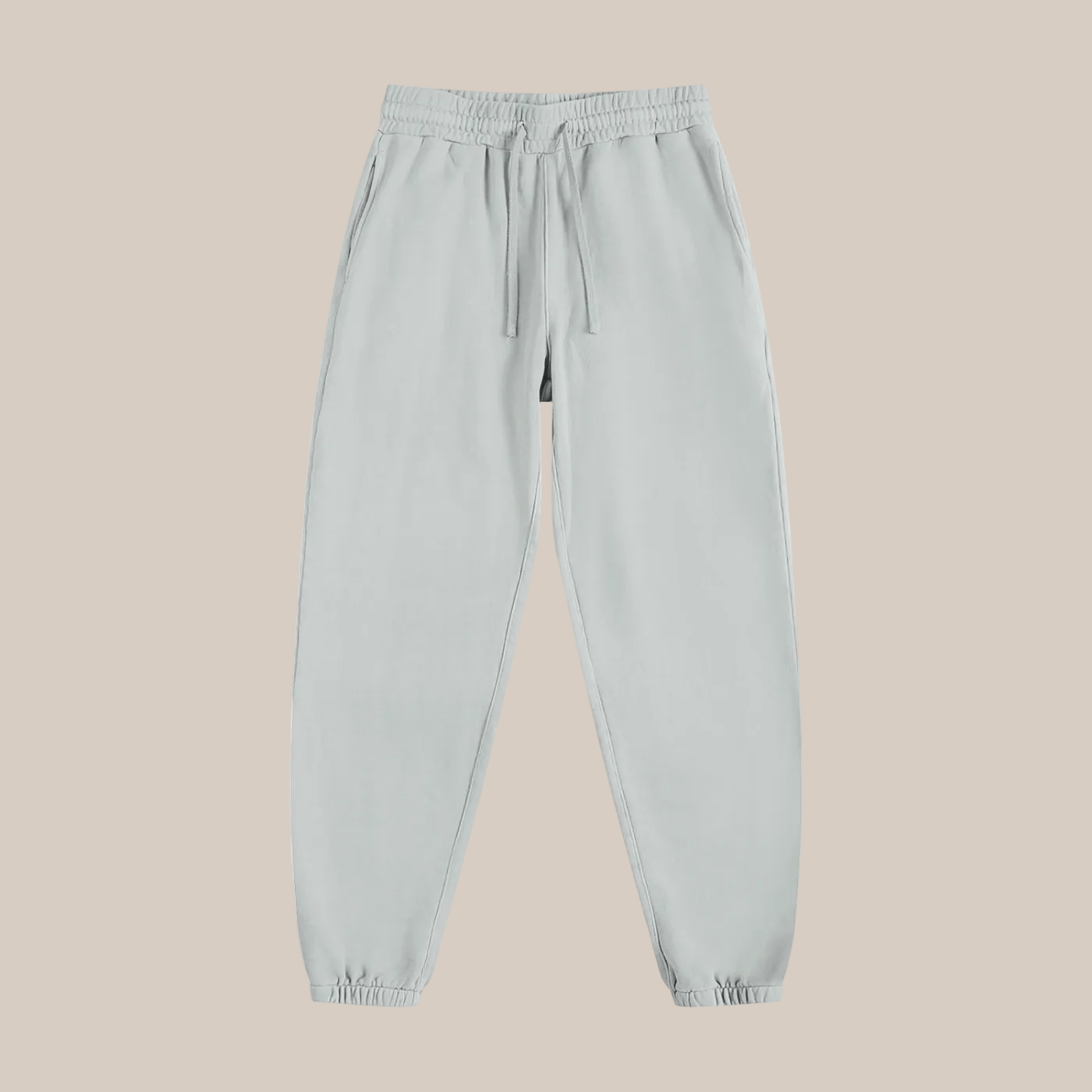 Light gray sweatpants on a beige background
