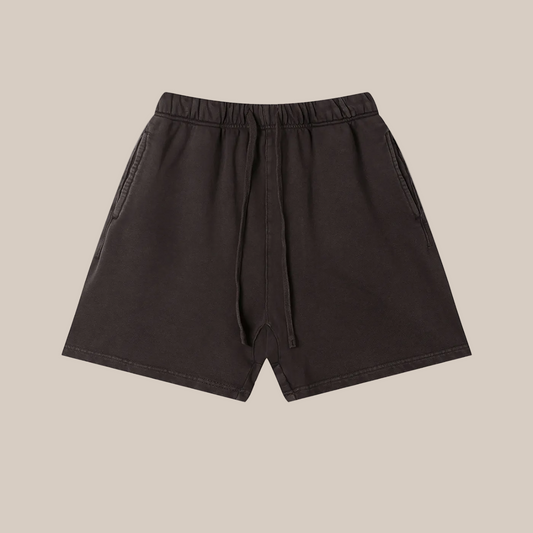 Dark purple short flat lay on a beige background