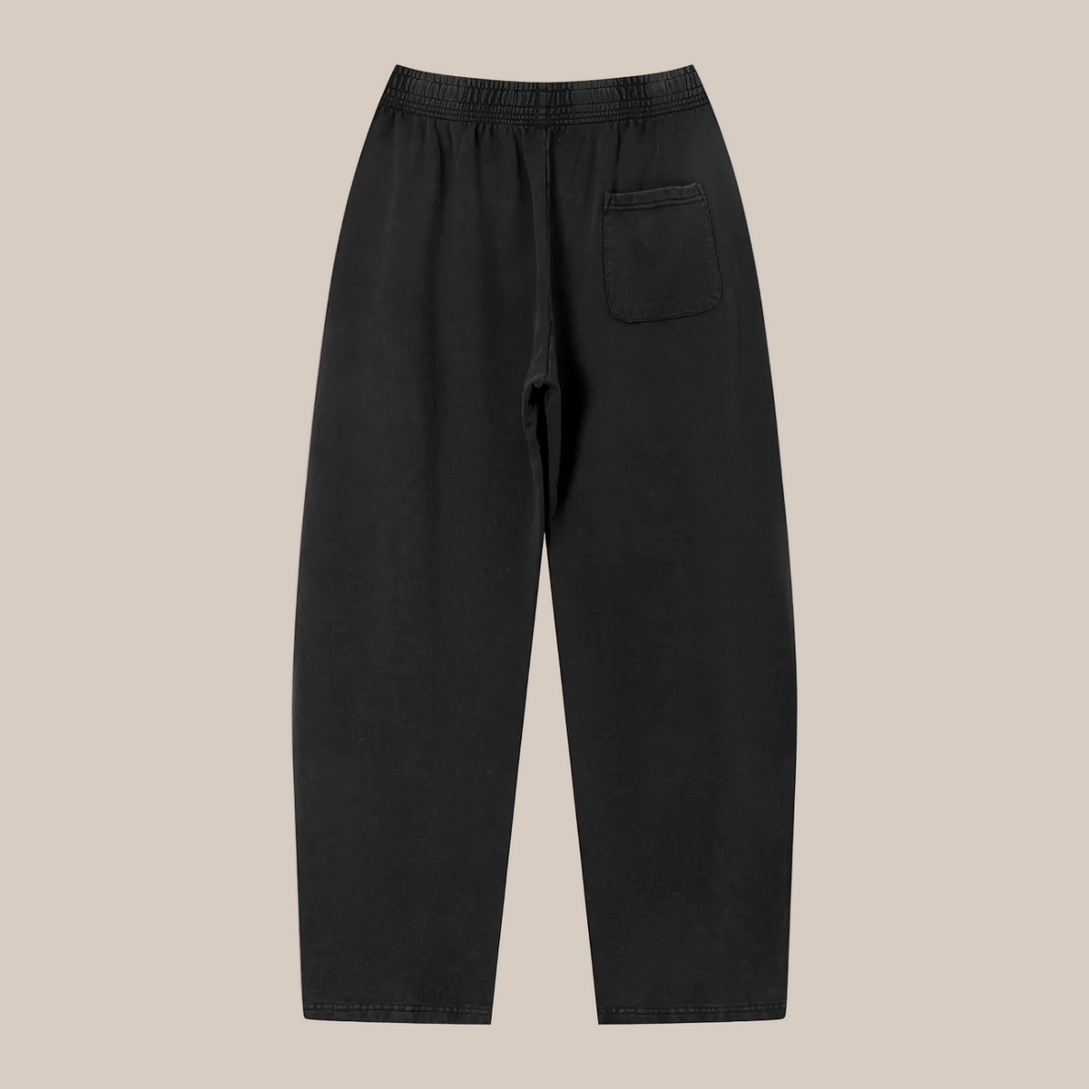Black pants with a pocket on a beige background