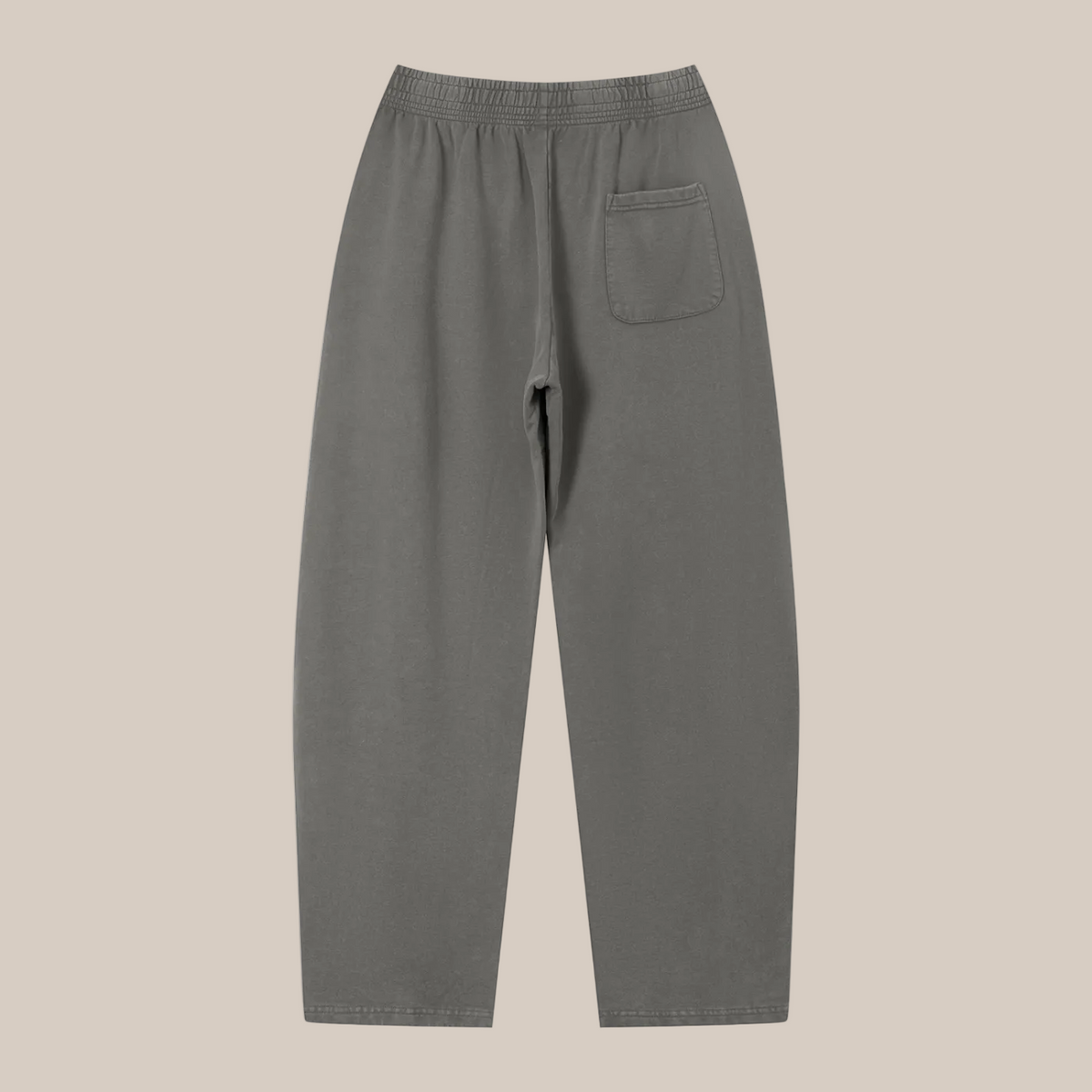 Gray sweatpants on a beige background