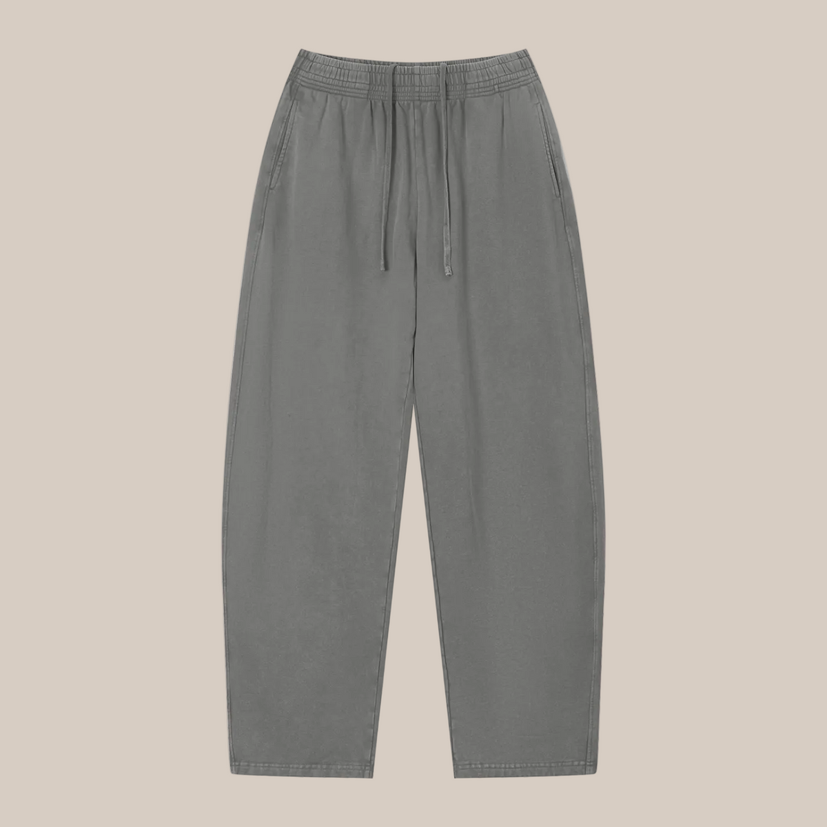 Gray sweatpants on a beige background